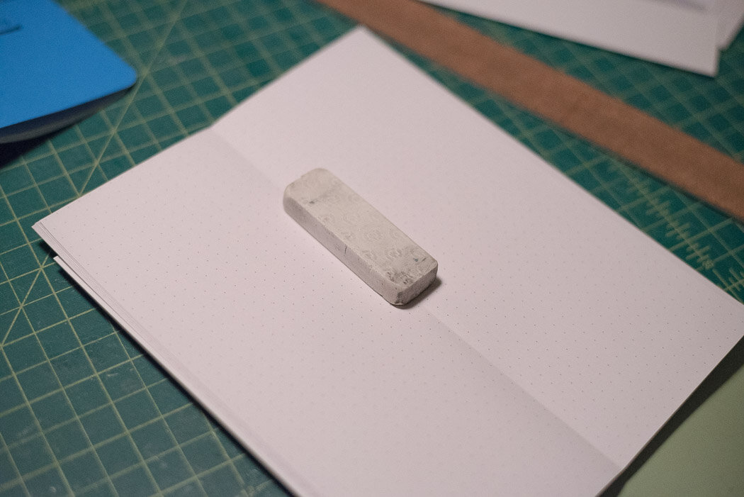 process photo showing the eraser on the inside of the notebook